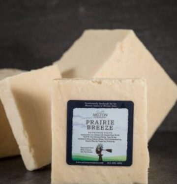 block of Milton Creamery 'Prairie Breeze' 9 month Aged Cheddar