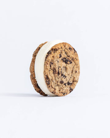 Cookie sandwich with cream filling on a white background
