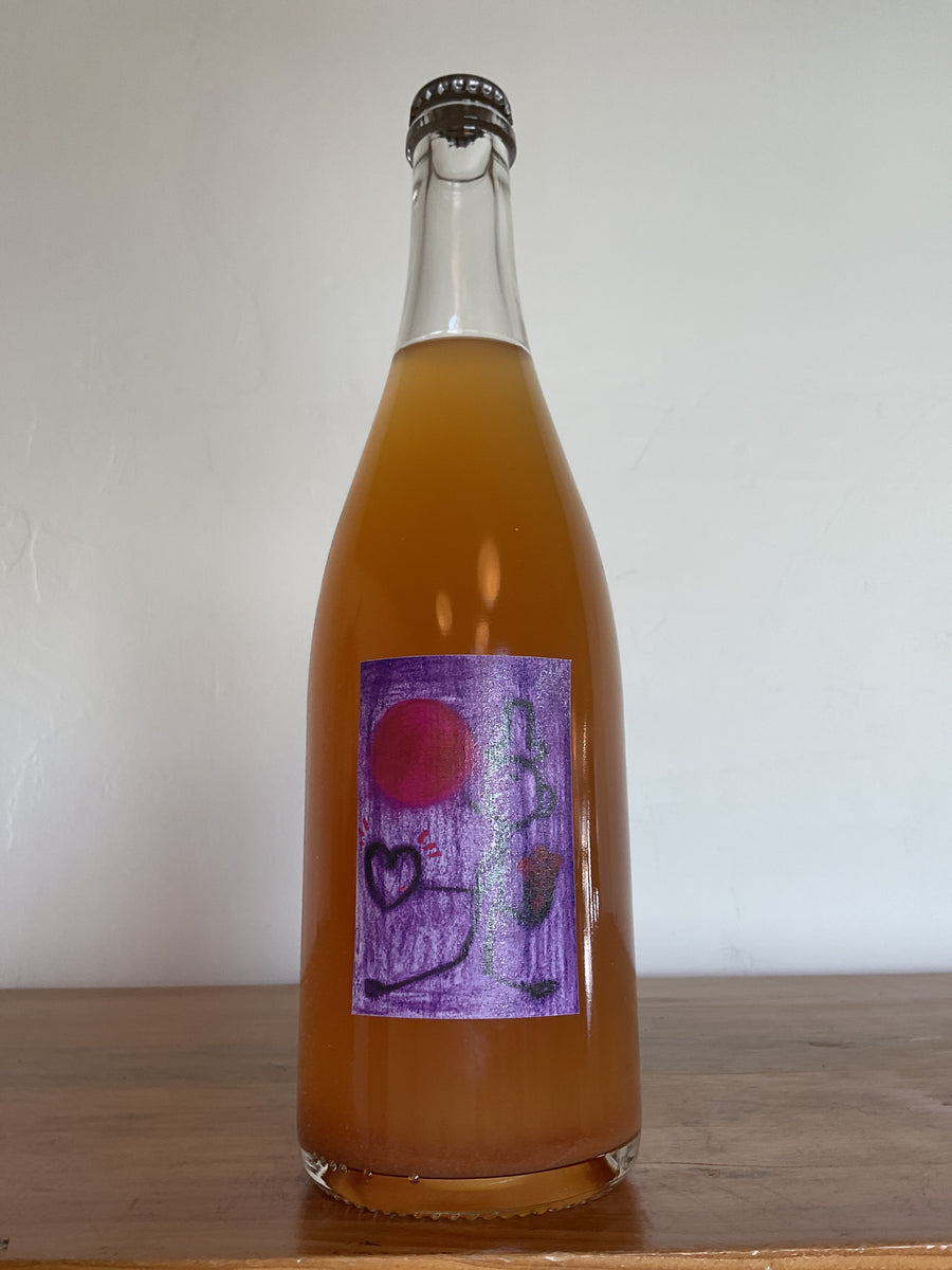A bottle of 2023 L'Absurde Genie des Fleurs 'Delta' Chardonnay